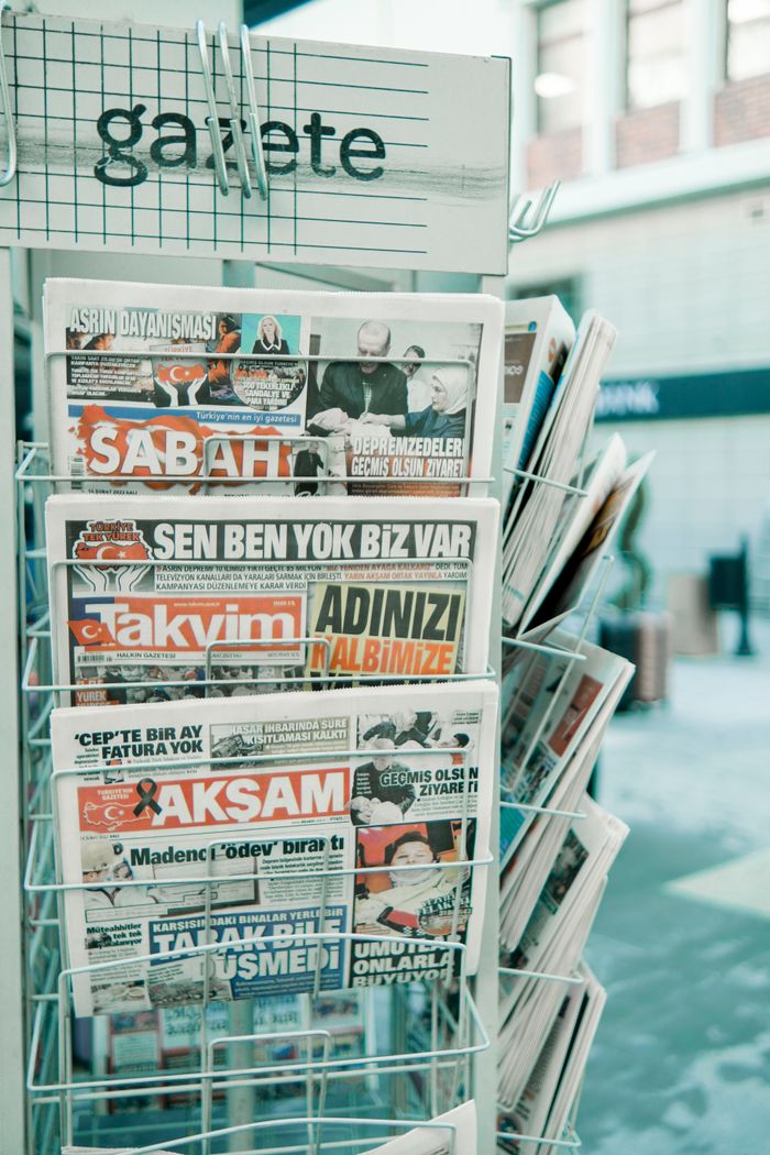 gallery-4 A rack with various Turkish newspapers displayed on the street for sale.