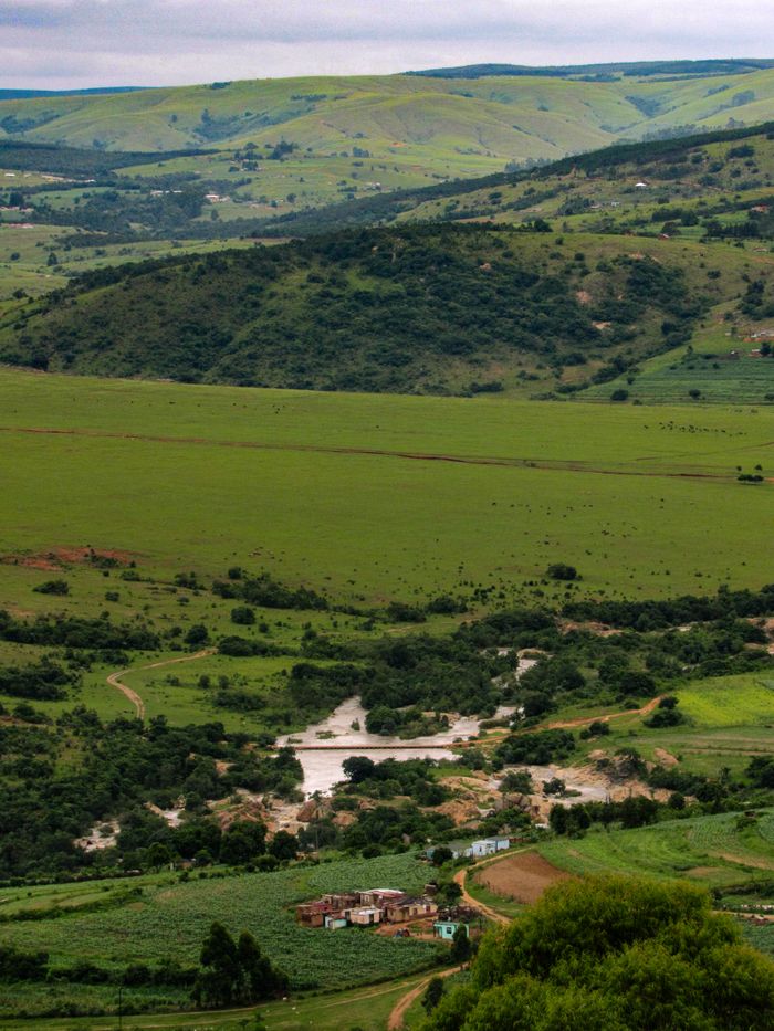 about-01 Scenic view of green hills and valleys near Nhlangano, Shiselweni Region, Eswatini.